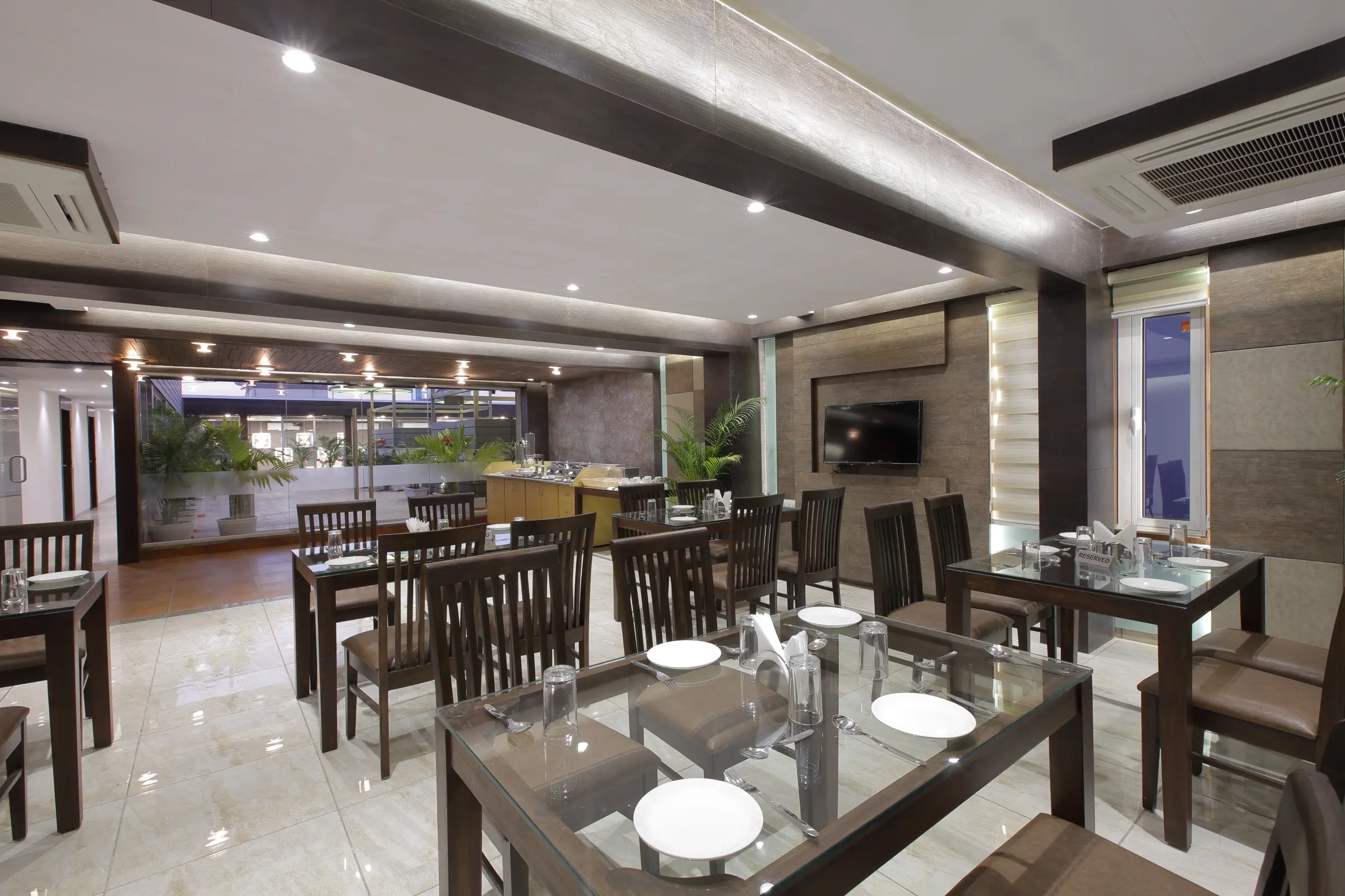 Elegant restaurant with linen-covered tables and ambient lighting
